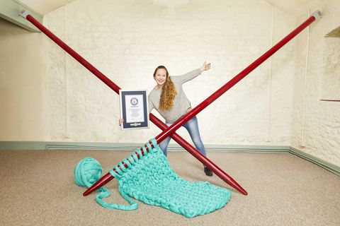 Elizabeth Bond breaks Guinness World Record for largest knitting needles.