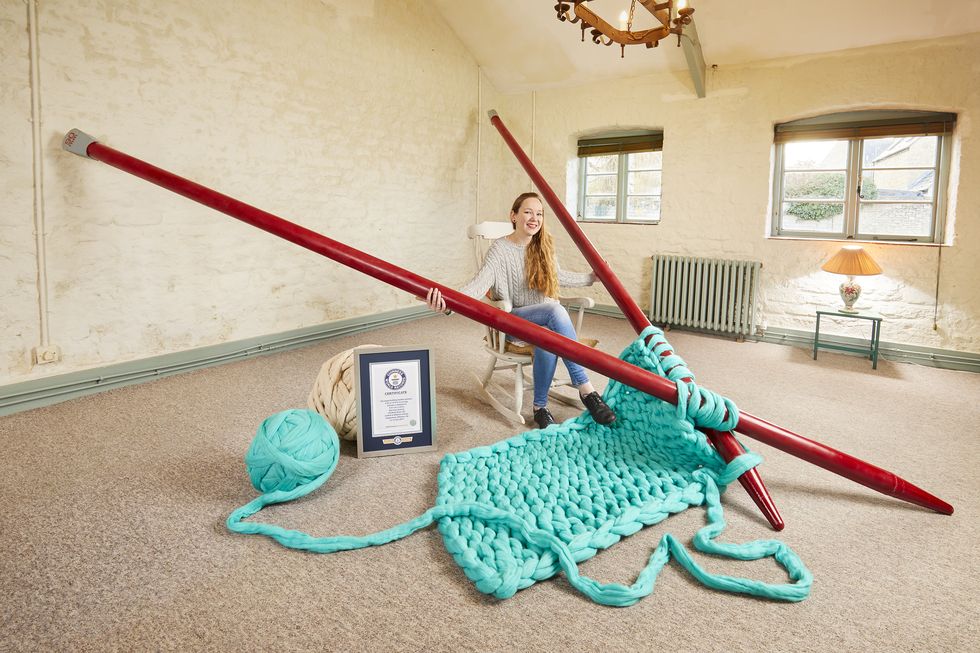 Elizabeth Bond breaks Guinness World Records for largest knitting needles.