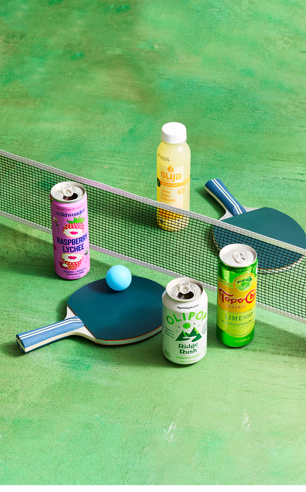 assorted beverages on a ping pong table