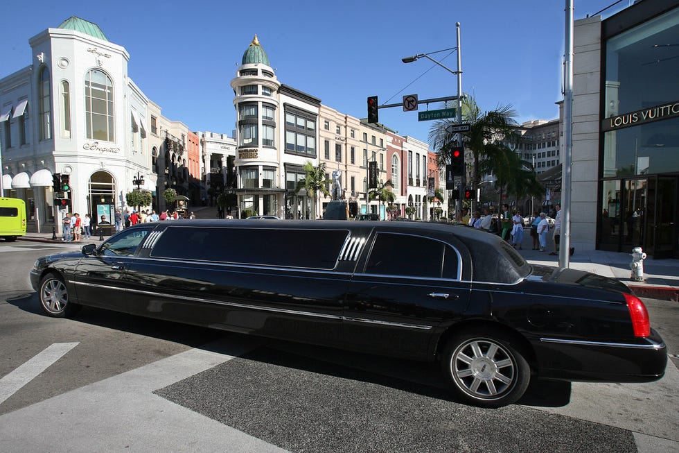 a limousine turns at an intersection