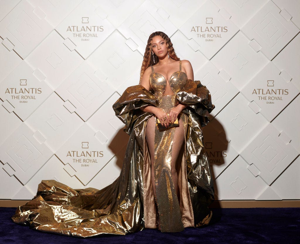 Beyoncé wears gold sequin hourglass dress to SirDavis party with Jay-Z