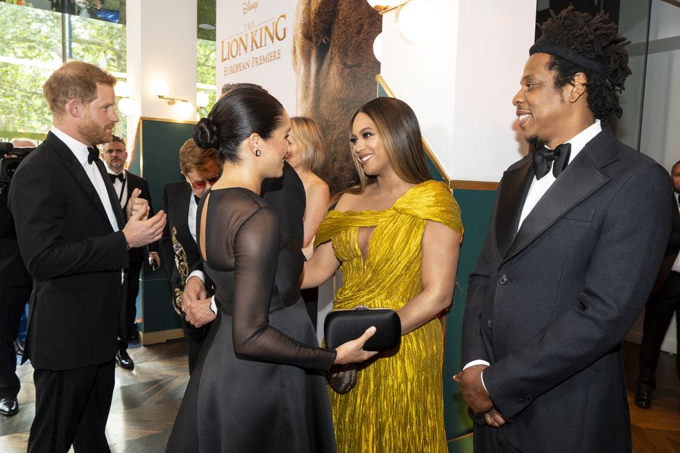 london, england july 14 prince harry, duke of sussex l and meghan, duchess of sussex 2nd l meets cast and crew, including beyonce knowles carter c jay z r as they attend the european premiere of disneys the lion king at odeon luxe leicester square on july 14, 2019 in london, england photo by niklas hallen wpa poolgetty images