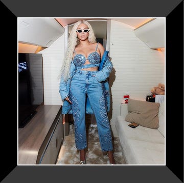 beyonce in denim outfit on plane