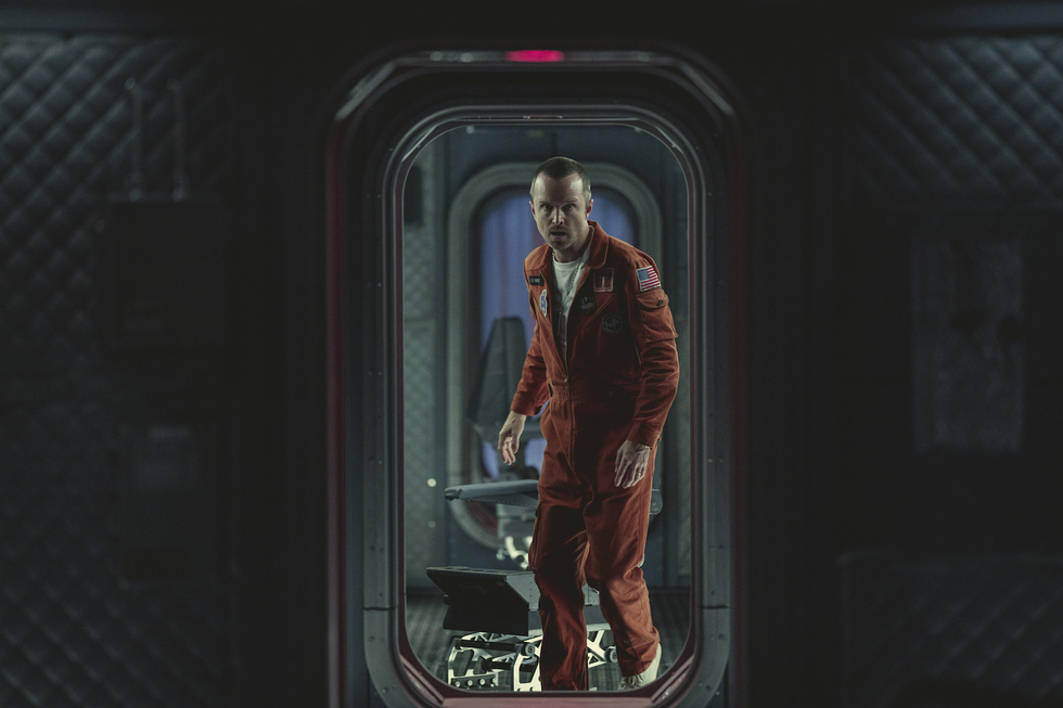 aaron paul stands in a space station in 'beyond the sea' in black mirror season 6