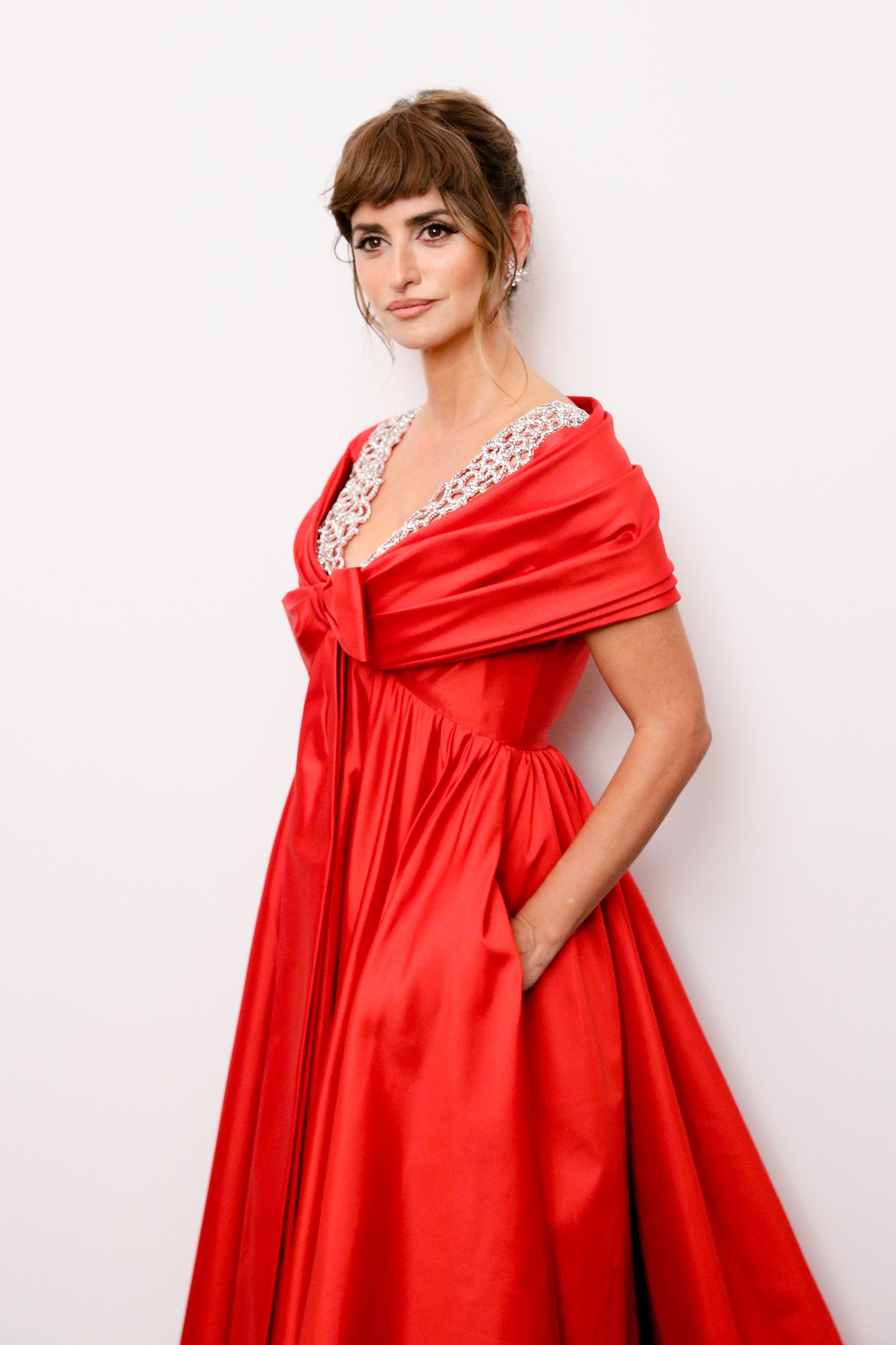 Penélope Cruz cuts a VERY stylish figure in Chanel as she jets out
