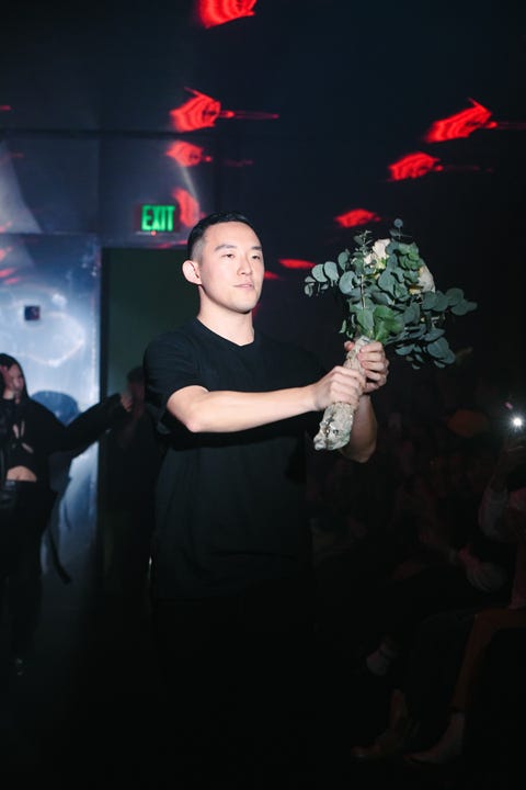 Dae Lim sundae school designer dae lim with a bouquet at a fashion show