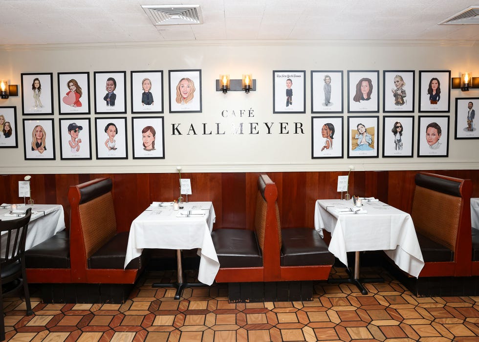Rectangular dining area featuring booths and artwork
