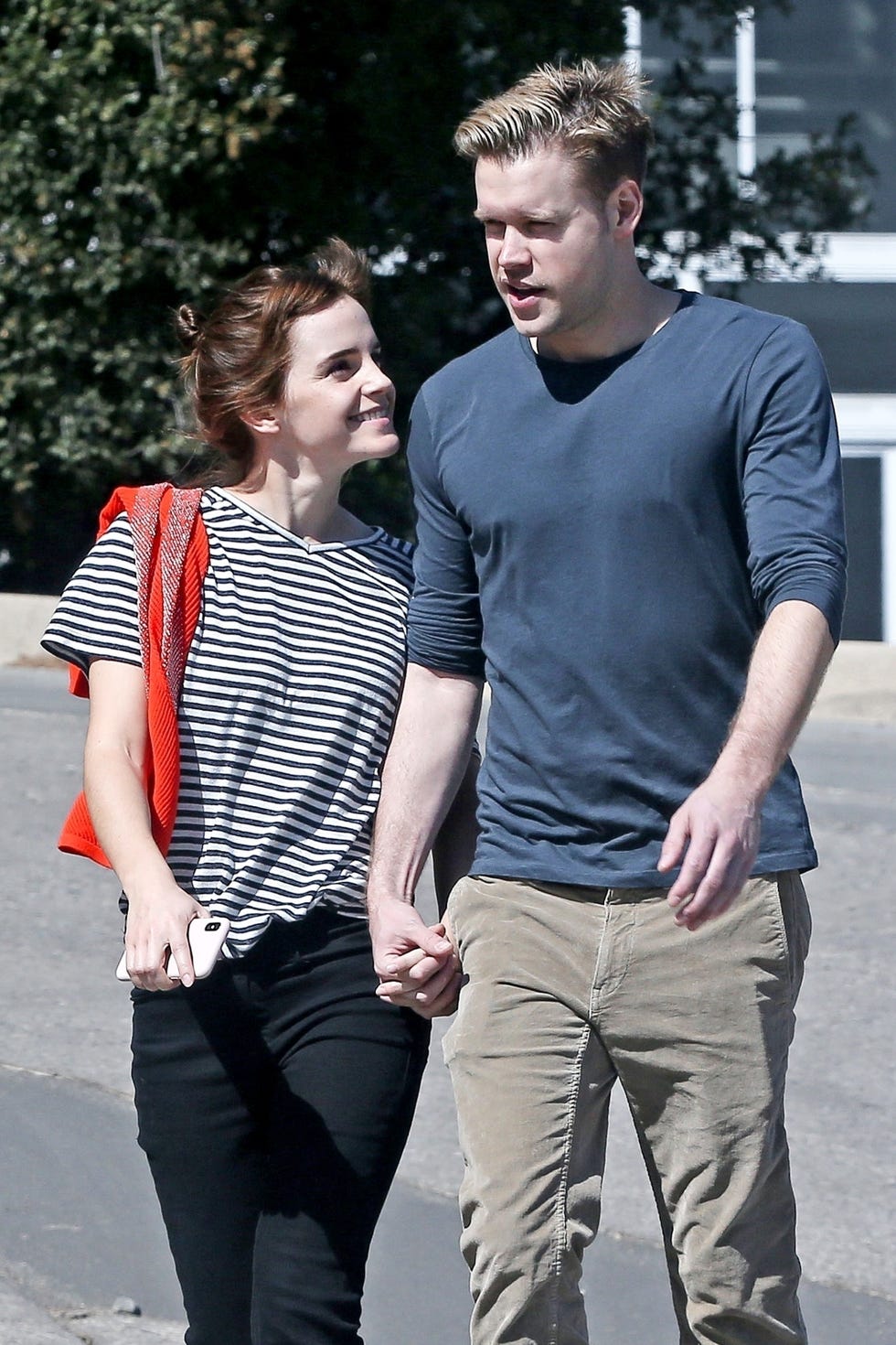 emma watson and chord overstreet holding hands and smiling