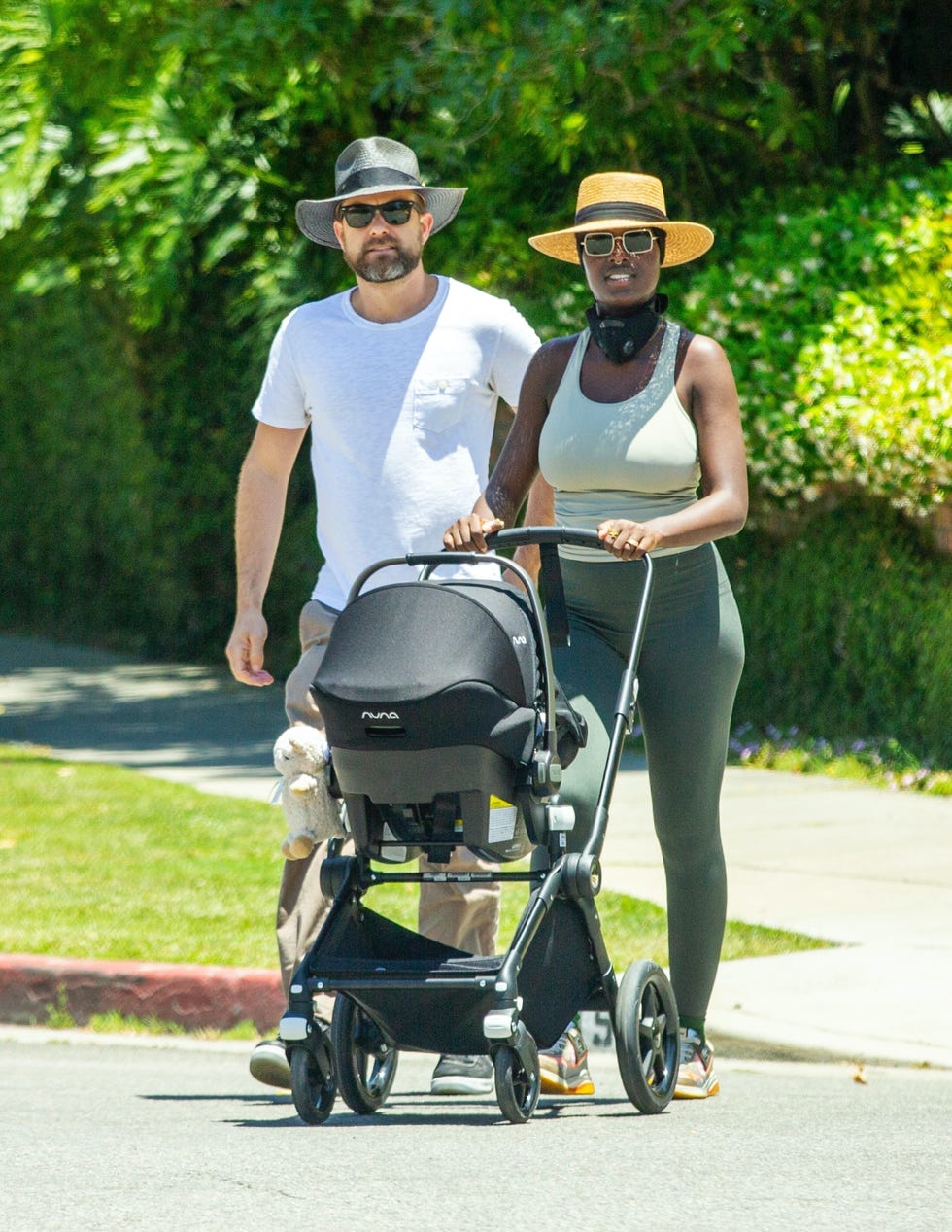 <b>Joshua</b> and Jodie wear matching hats on a walk. 