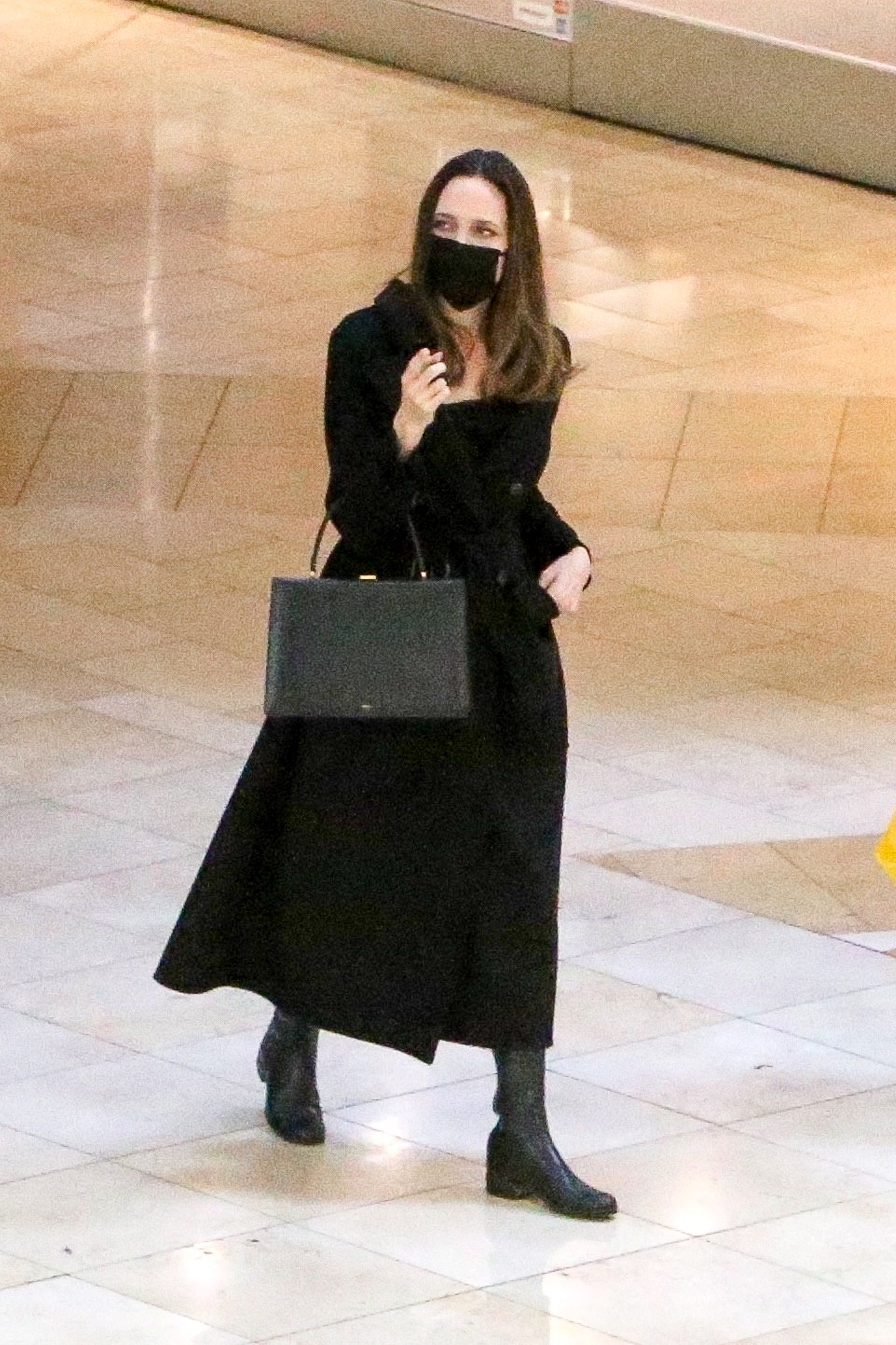 Angelina Jolie wears a sleek all-black outfit as she takes her kids Zahara  and Shiloh shopping in LA