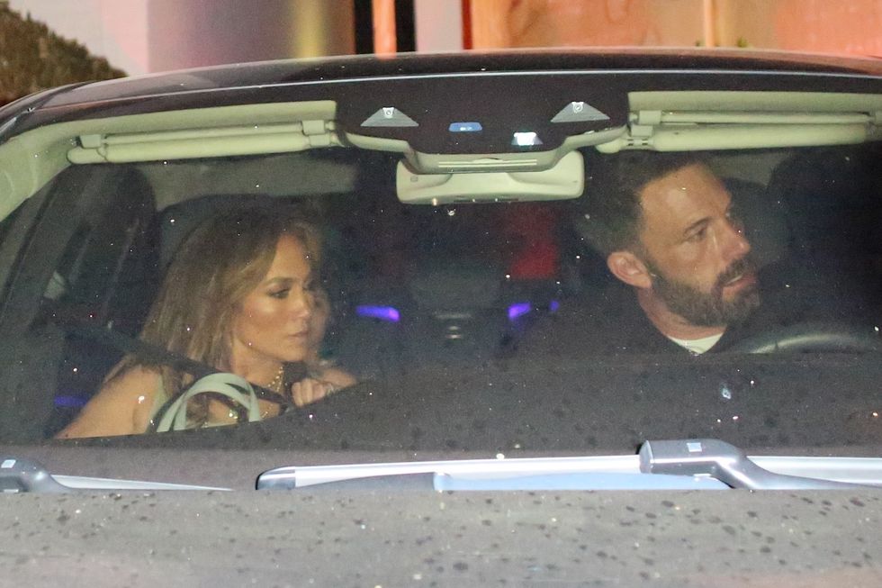 jennifer lopez in beige tank and white trousers and bennifer in the car