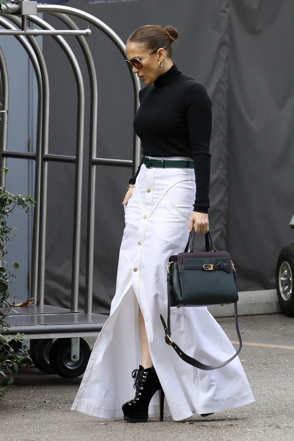 jlo in black turtleneck and white maxi skirt