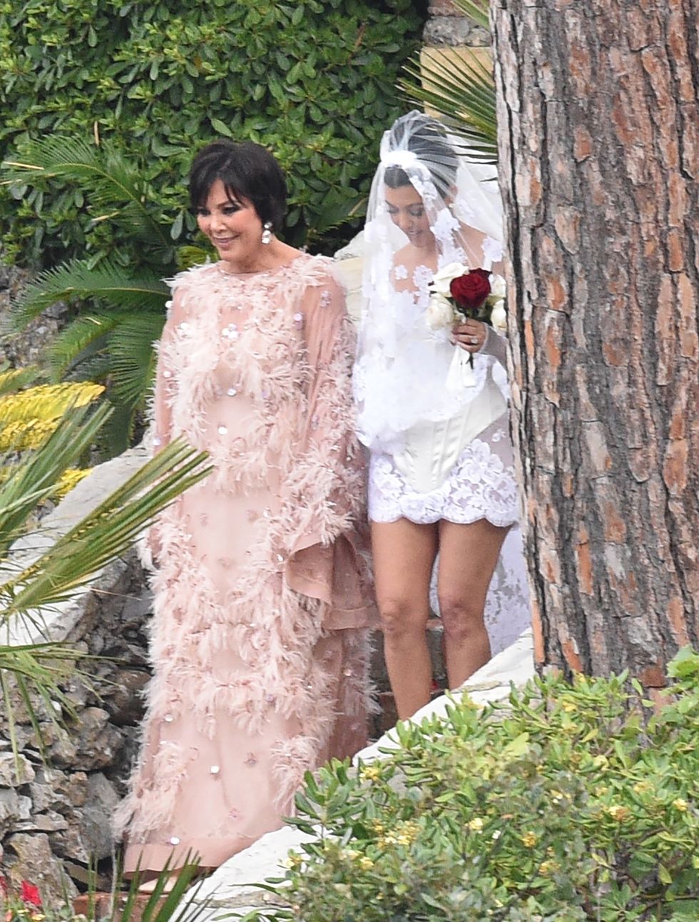 With her floral dress, Kylie Jenner found the perfect wedding guest outfit  for Kourtney Kardashian and Travis Barker's wedding