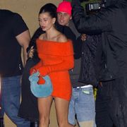 hailey and justin photographed leaving a building at night time