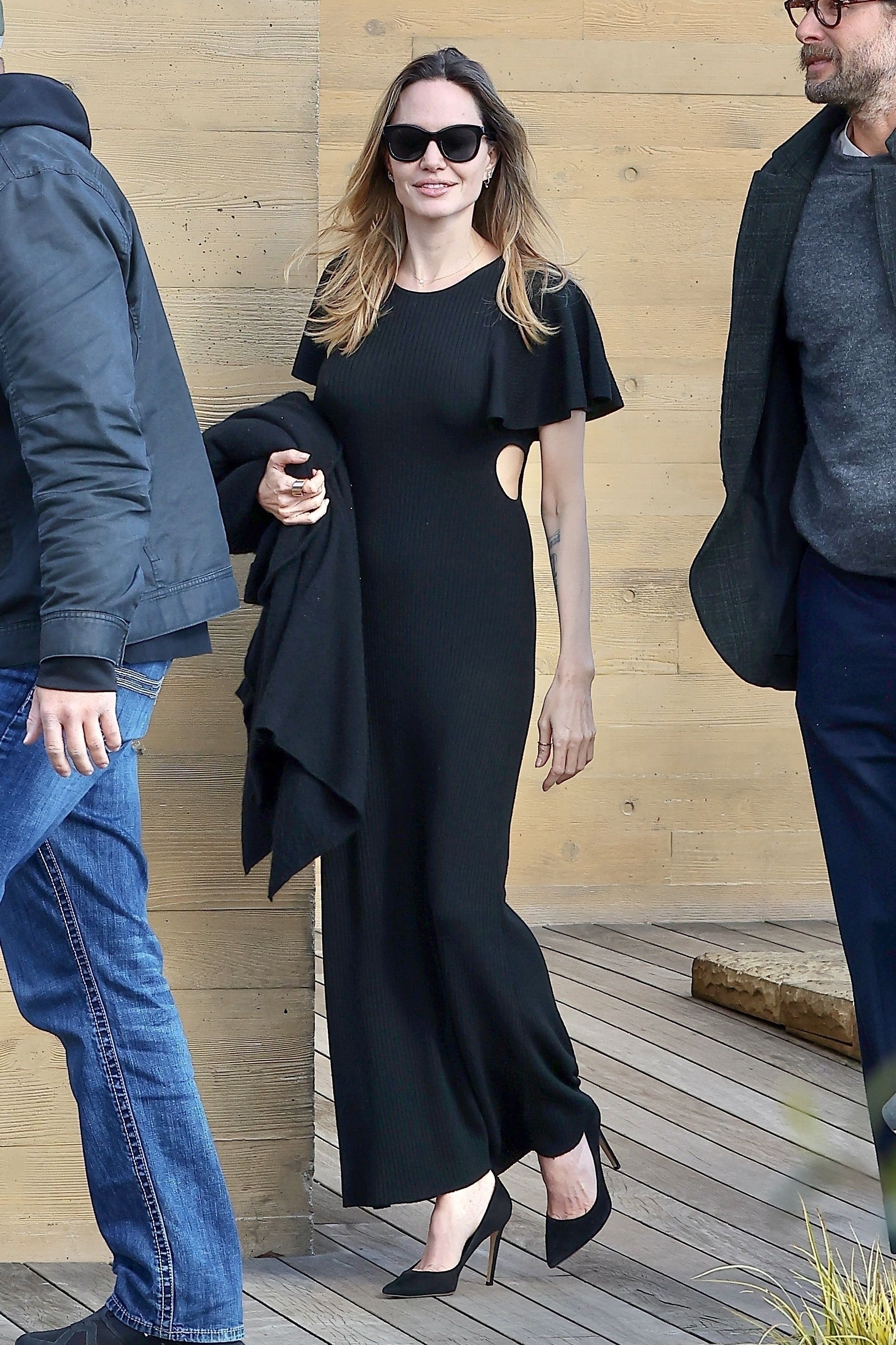 Angelina Jolie puts on a glamorous display in a black maxi dress