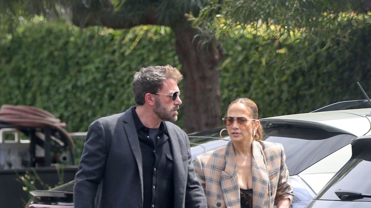Jennifer Lopez's Dolce & Gabbana black lace bodysuit and blazer, flower  earrings, and sunglasses