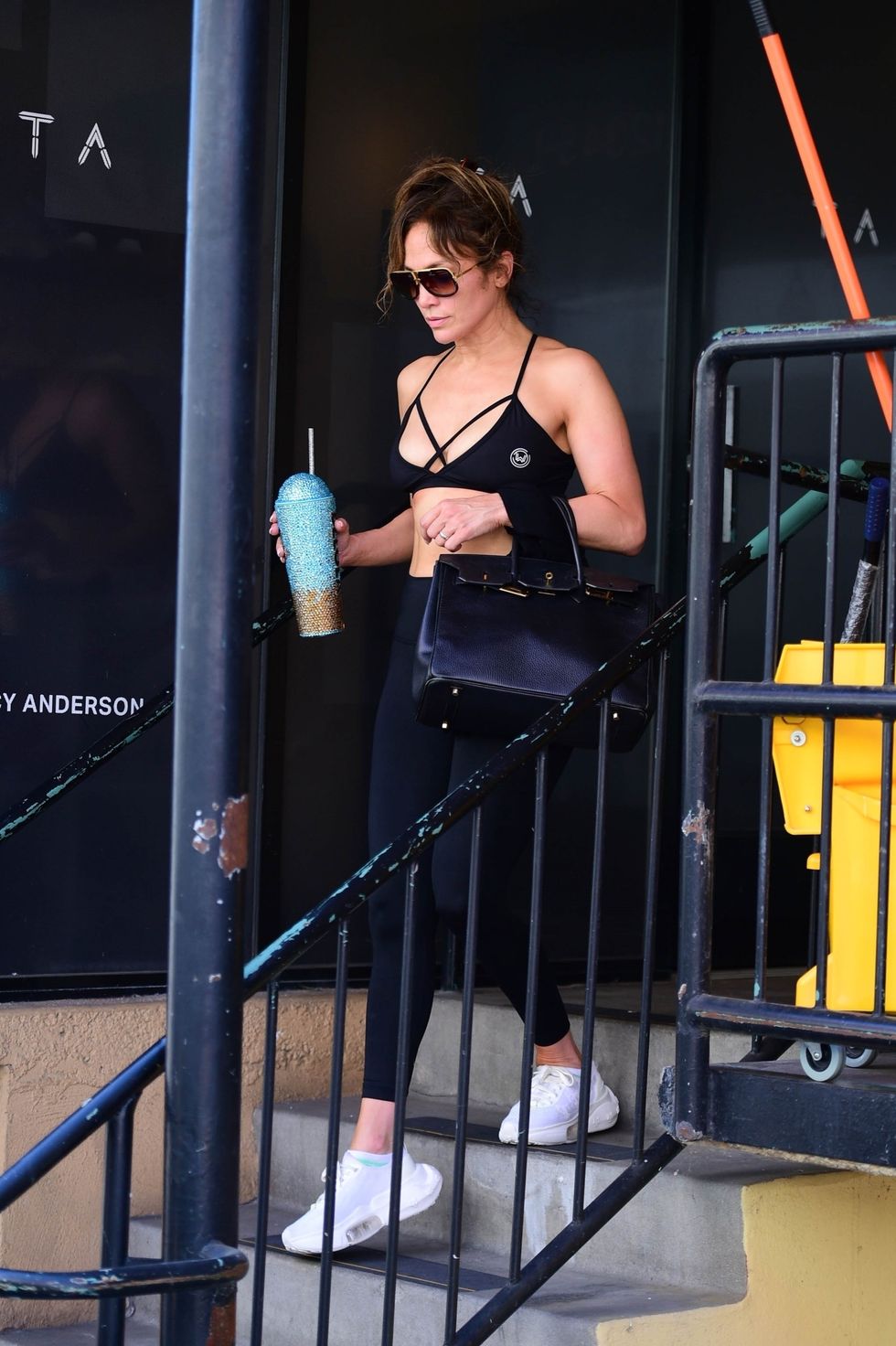 J Lo Wears a Hot Pink P.E Nation Sports Bra and Biker Shorts