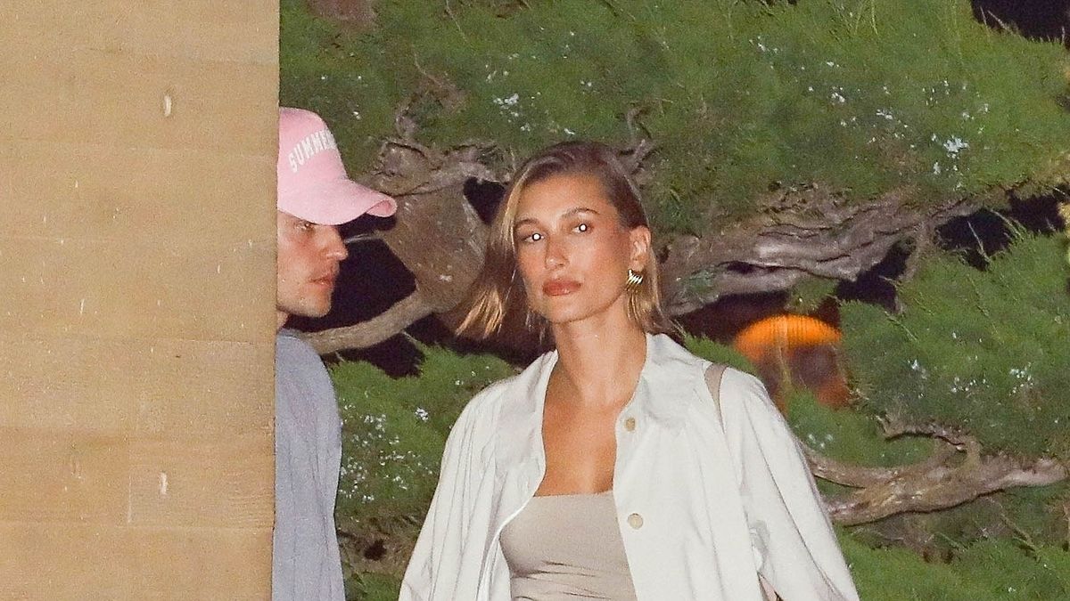 Hailey Bieber Does Date Night in Jersey Minidress and Trench Coat