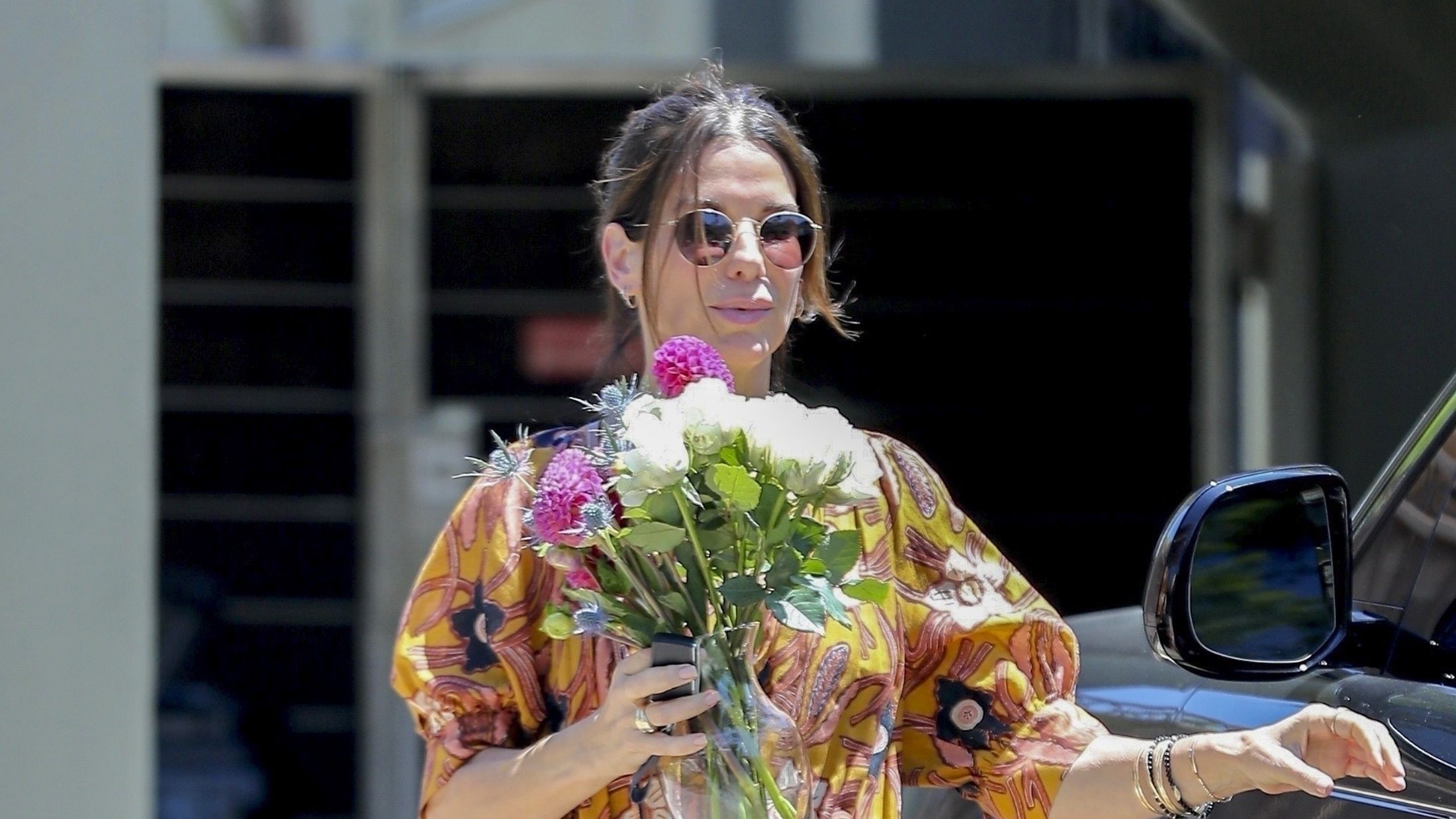 Sandra Bullock Looks So Fabulous in a Floral Dress and Basket Bag