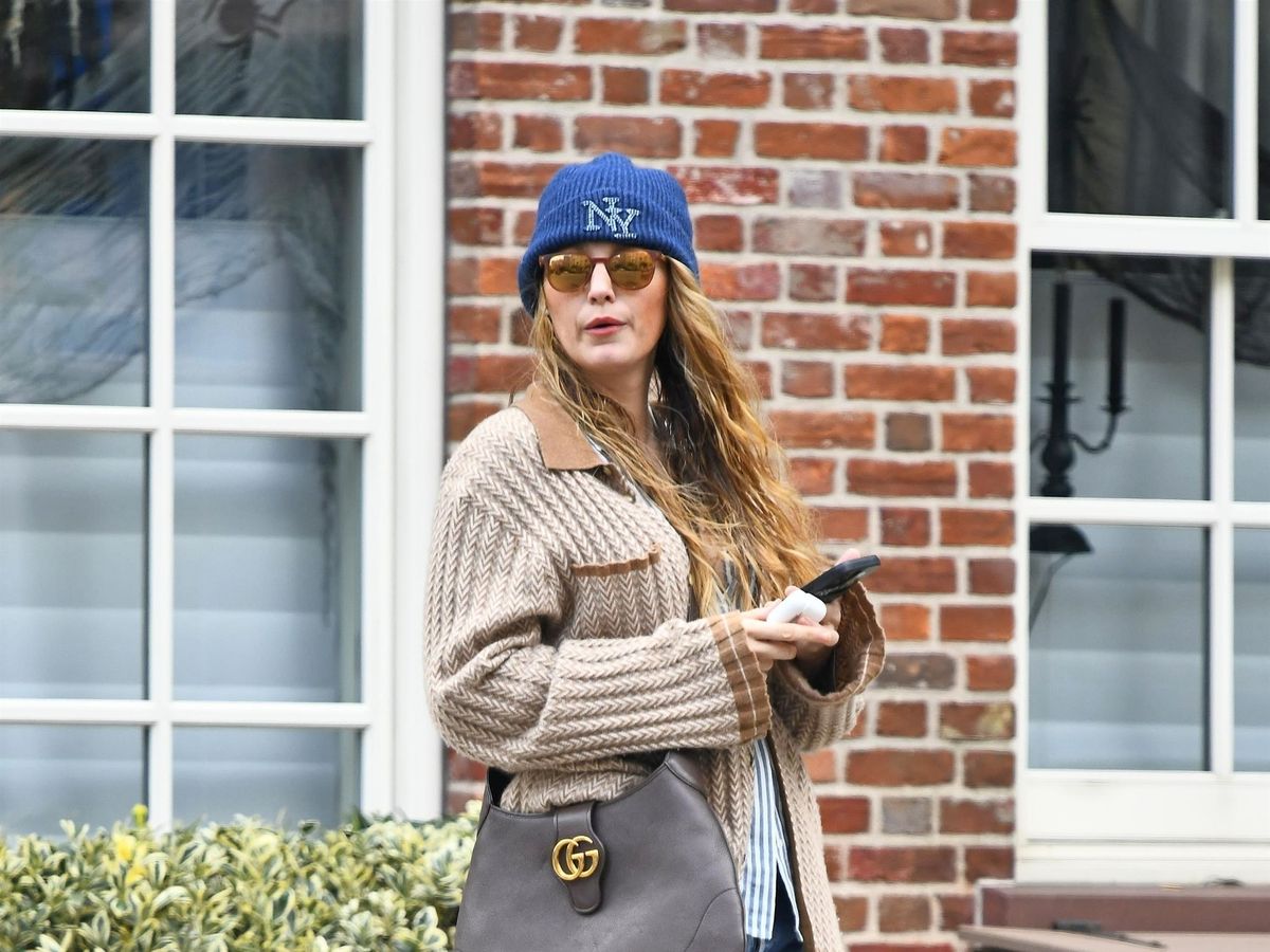 Blake Lively ditches her usual glamorous look as she bundles up in cardigan  sweater and 70s-style bell bottom jeans in chilly New York City