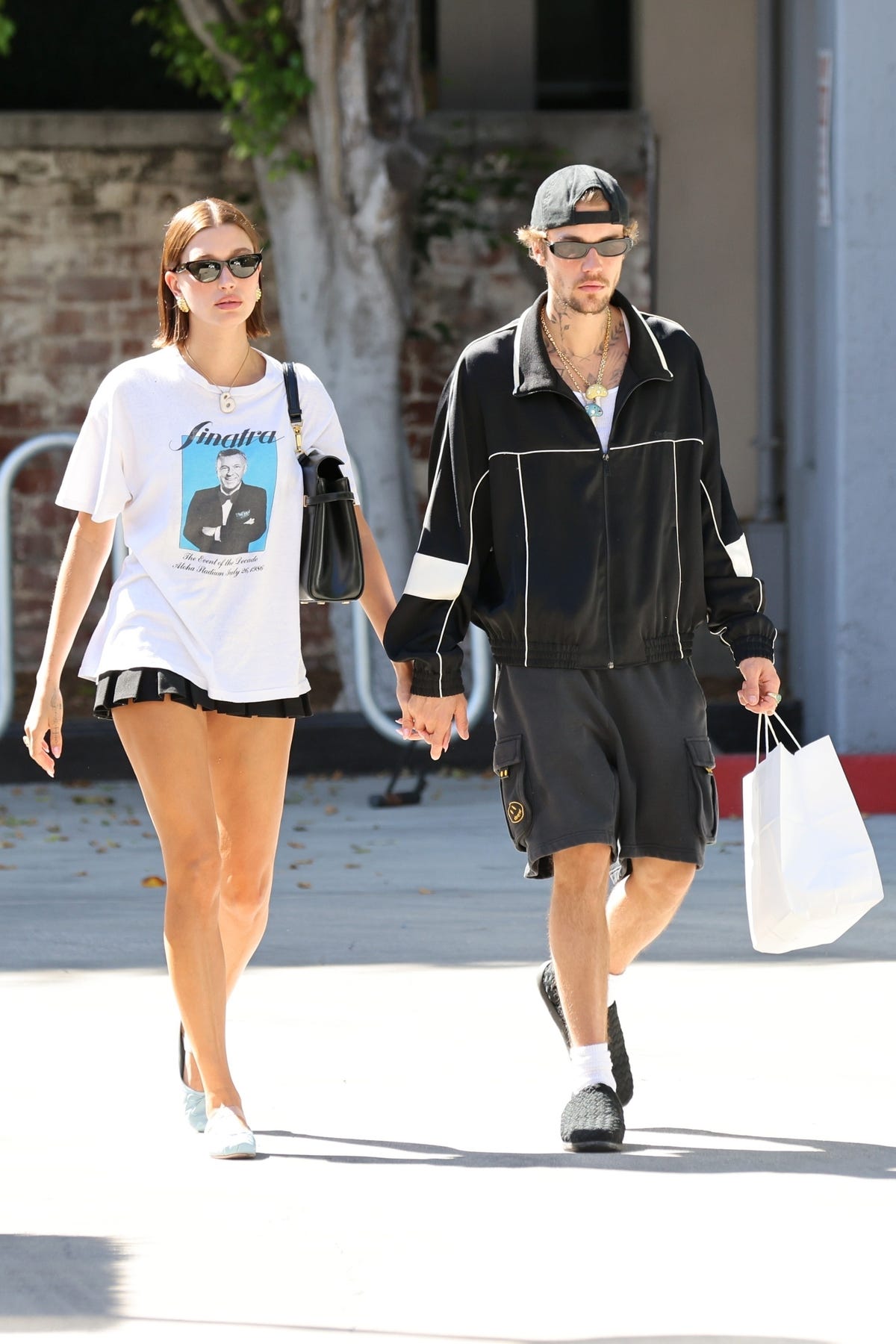 Hailey Bieber Layers an Oversize Graphic Tee Over a Teeny Miniskirt