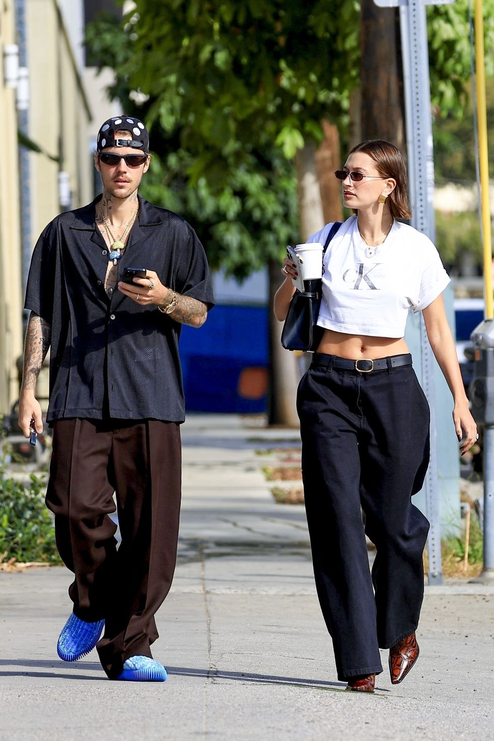justin and hailey walking down the street