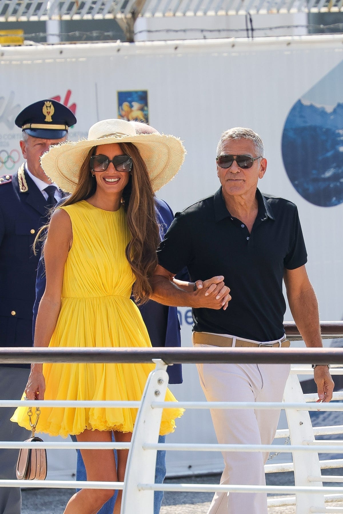 Amal Clooney Makes Her Venice Arrival in a Ruched Canary Yellow Dress