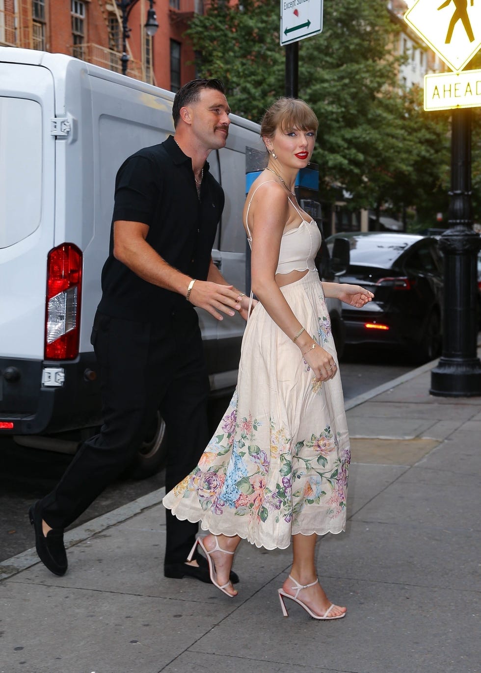 Taylor Swift Wore a Cream Floral Gown to Attend a Wedding with Travis Kelce