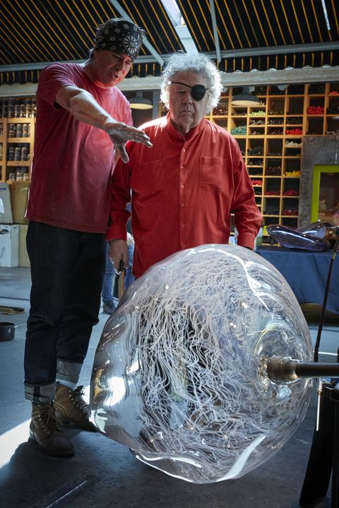 two men with large glass object