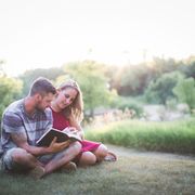 god strength quotes  man and woman sitting on hill reading from the bible