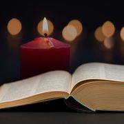 bible open with candle burning