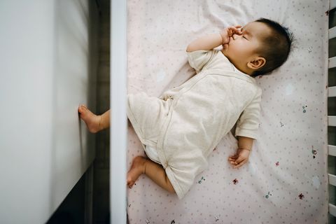biblical baby names christian names show a devotion to god baby sleeping in crib sucking thumb