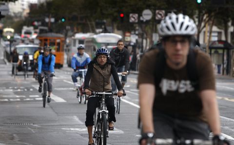 bicycle commuters have room to ride on eastbound market street after traffic was forced to turn right at eighth street in san francisco