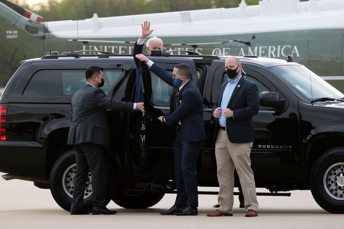 us president joe biden waves as he gets into a car upon arrival in new castle, delaware, on april 16, 2021 photo by jim watson  afp photo by jim watsonafp via getty images