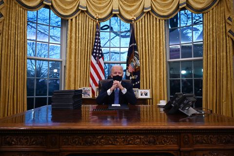 president joe biden in the oval office on inauguration day﻿