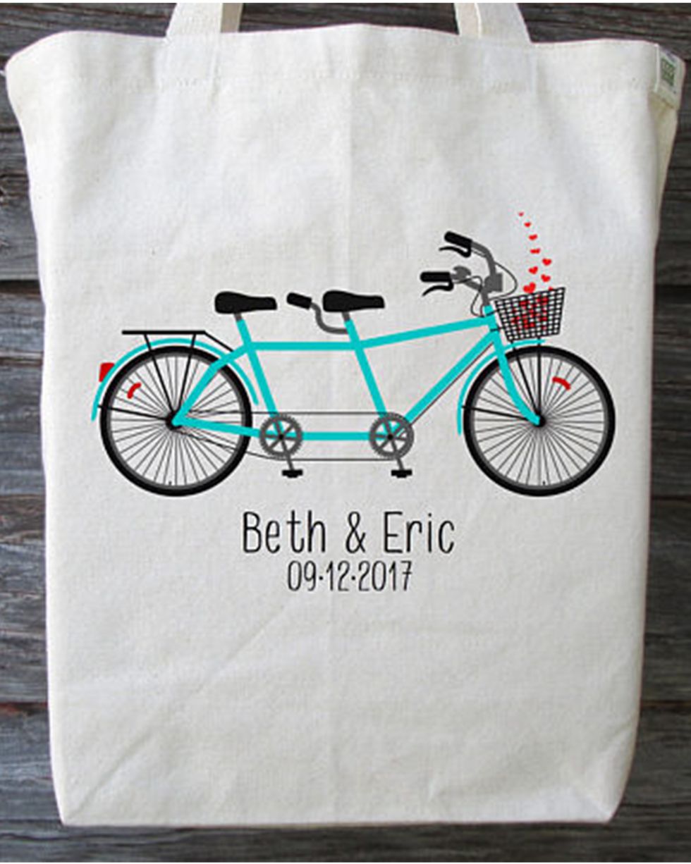 Bag, Bicycle, Bicycle wheel, Vehicle, Tote bag, Bicycle accessory, Pillow, Bicycle part, Textile, Luggage and bags, 