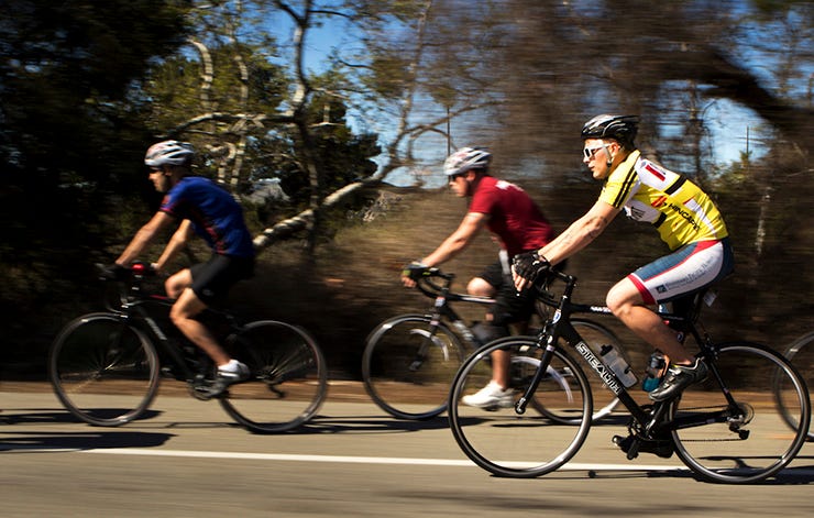 cyclists riding