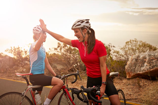 bikeriders  training partners doing high five