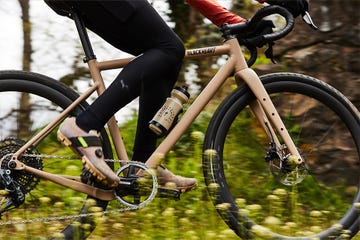 a person riding a bike through white flowers