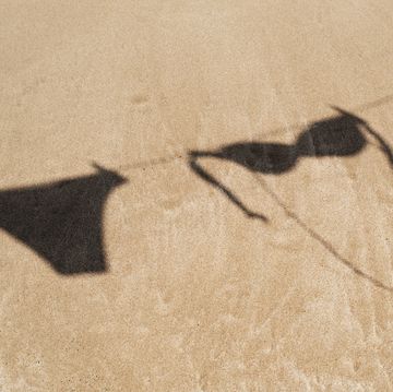 bikini hanging on a clothes line on the beach