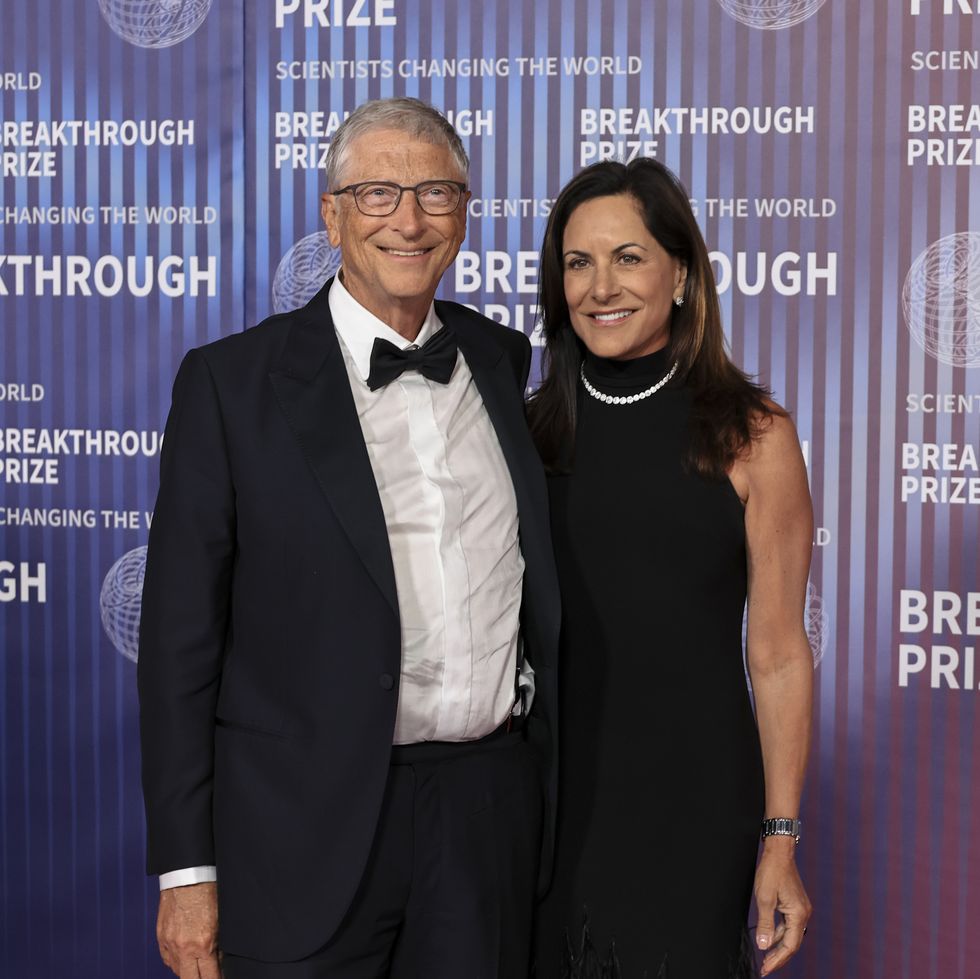 bill gates and paula hurd pose together in evening wear