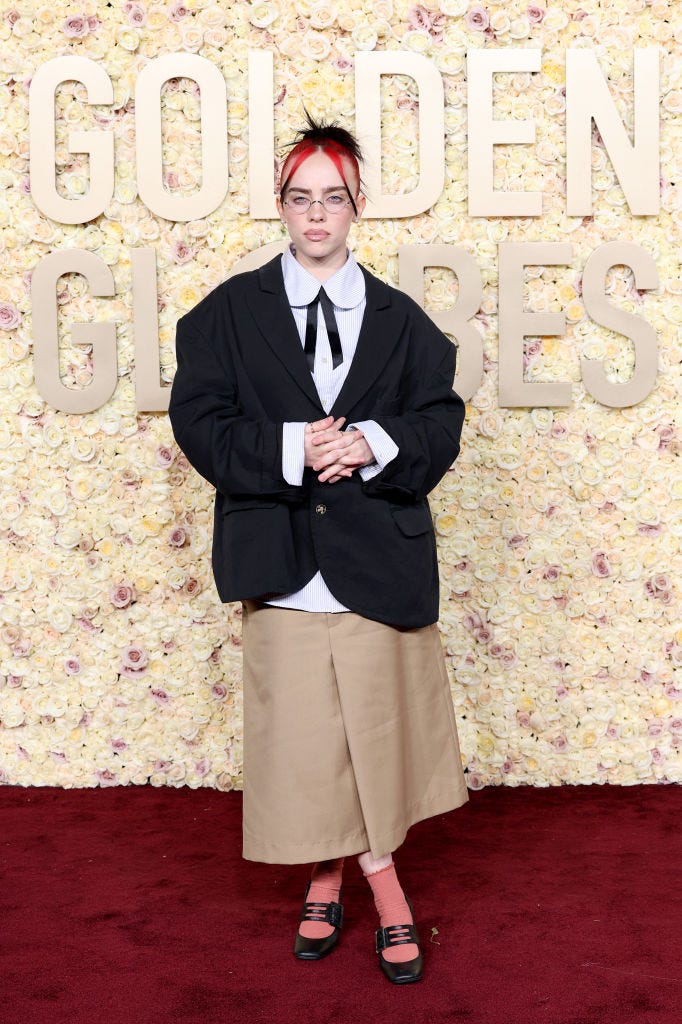 Billie Eilish Hits the 2024 Golden Globes With Cute Glasses and Red