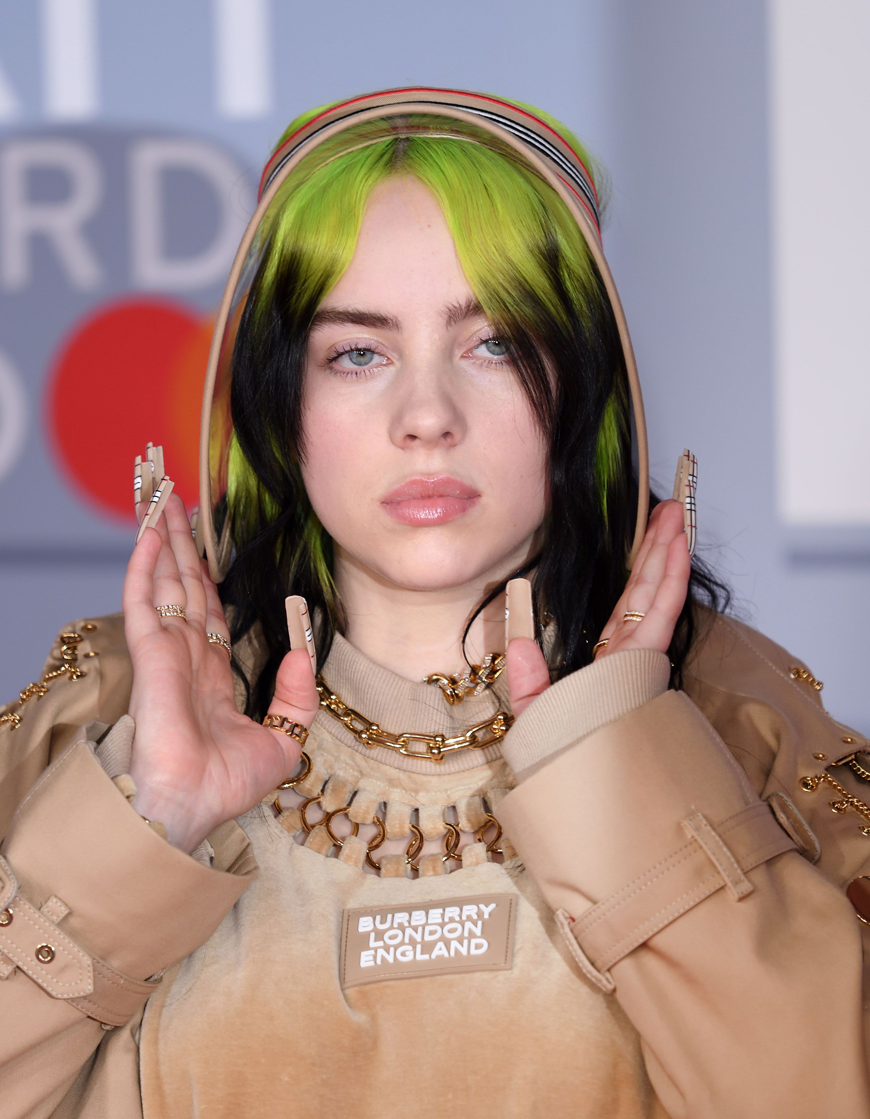 Billie Eilish begs fans to stop making fun of her neon green hair