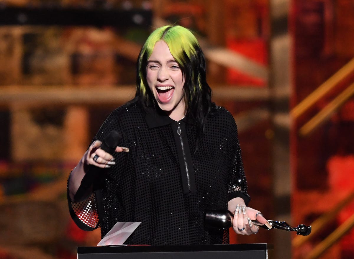 Billie Eilish shows real skin texture (with ukulele in her mouth)