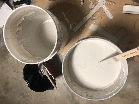 white paint in buckets