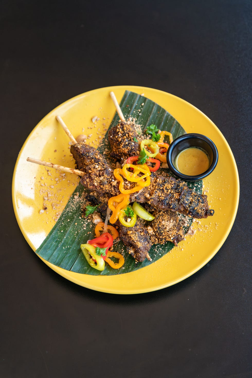 suya beef skewers, spiced peanuts, pepper sauce