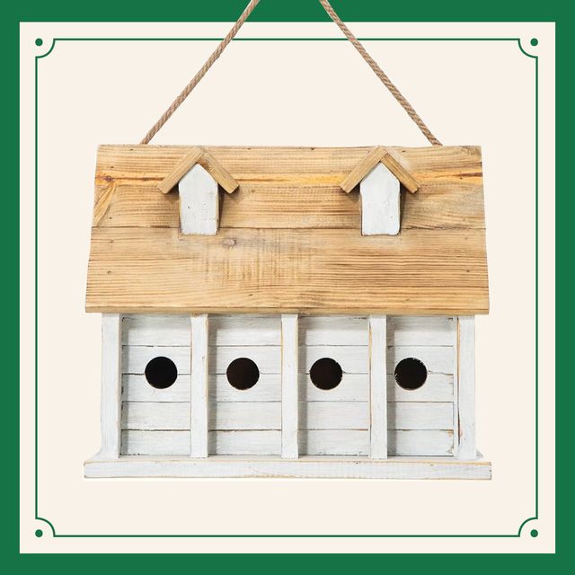 a wooden birdhouse with holes