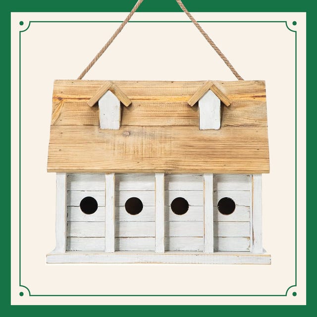 a wooden birdhouse with holes