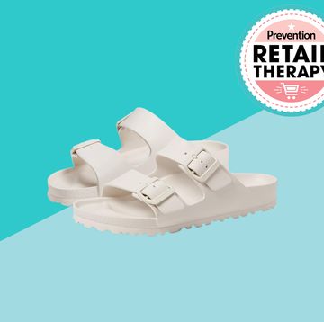 birkenstock arizona eva white sandals in front of two blue triangles with a retail therapy prevention sign