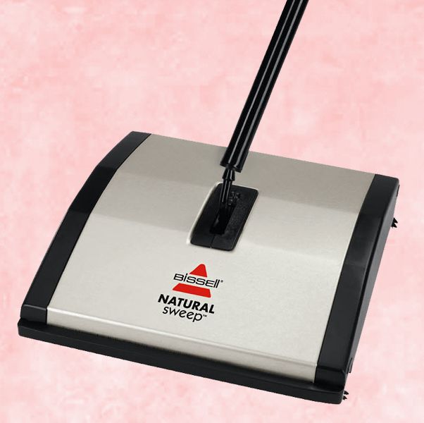 bissell carpet sweeper with pink, textured background